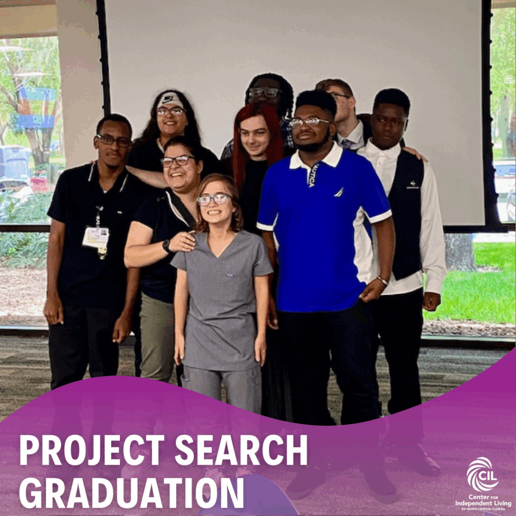 A group of nine smiling young adults stand together in front of a projector screen during the 2024 Project SEARCH Graduation. Some wear work uniforms, including scrubs and ID badges, representing the departments they interned in. The atmosphere is joyful and celebratory. The bottom of the image features a purple graphic overlay with the text "PROJECT SEARCH GRADUATION" and the Center for Independent Living logo.
