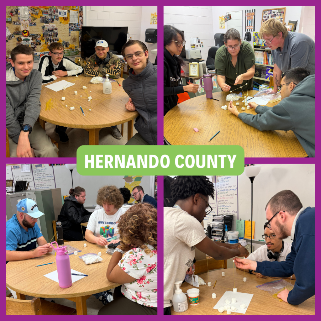 Students from Project Looking Ahead at Hernando High School and instructors collaborate at classroom tables during a teamwork activity, building freestanding structures with spaghetti and marshmallows as part of a soft skills exercise.