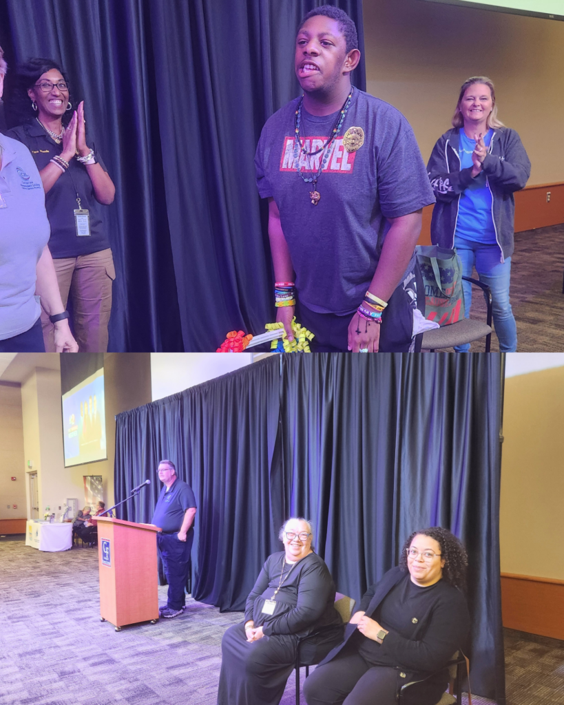 A collage of moments from a community event. In the top image, an individual stands at the front of a room holding colorful items while others nearby smile and applaud, creating a celebratory and supportive atmosphere. In the bottom image, a speaker stands at a podium addressing the audience, while two individuals sit nearby smiling, with a stage and black curtain backdrop behind them.